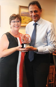 Revesby Workers' CEO Ed Camilleri receives the OOPS Large Club Superior Service award from OOPS Managing Director Michelle Pascoe